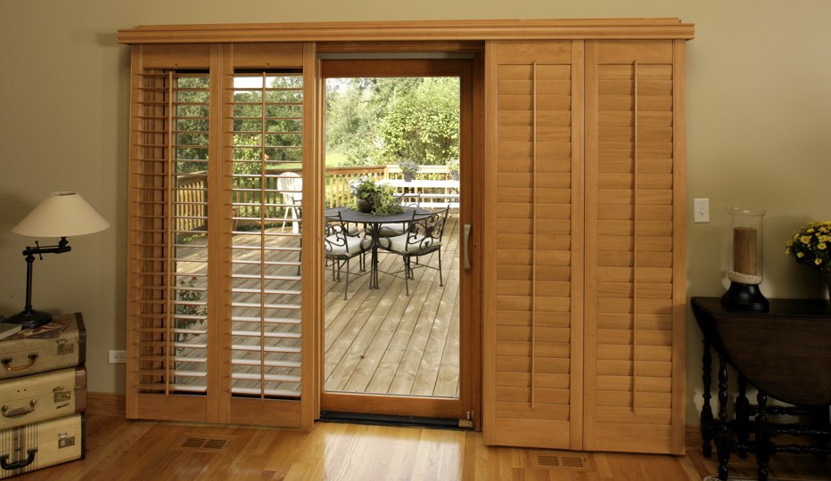Wood bypass patio door shutters in Southern California living room